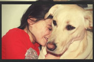 a girl and her lovale yellow lab