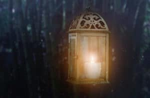 A lit lantern at night