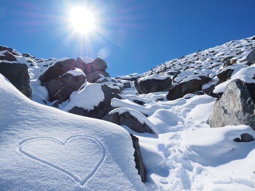 mountain with sunshine and a heart in the snow...